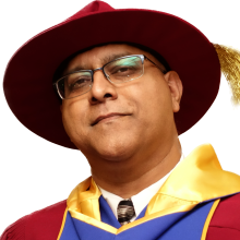 Nalinaksha Bhattacharyya headshot in PhD robes